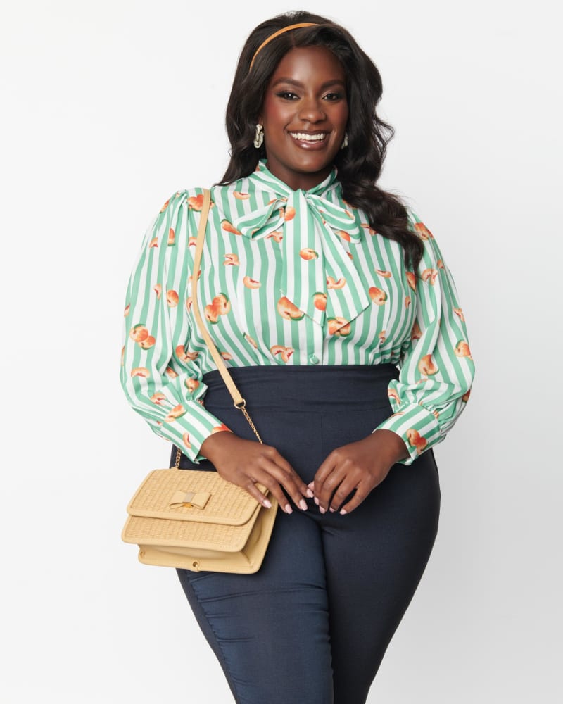 Front of a model wearing a size 5X/26 Unique Vintage Plus Size Green Stripe & Peaches Gwen Blouse in Green Stripe & Peaches by Unique Vintage. | dia_product_style_image_id:270088